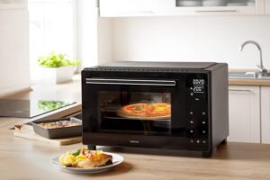 آون توستر سنکور مدل SEO 3250BK با ظرفیت ۳۵ لیتر، بدنه استیل و پنل کنترل لمسی دیجیتال به همراه سیخ جوجه گردان